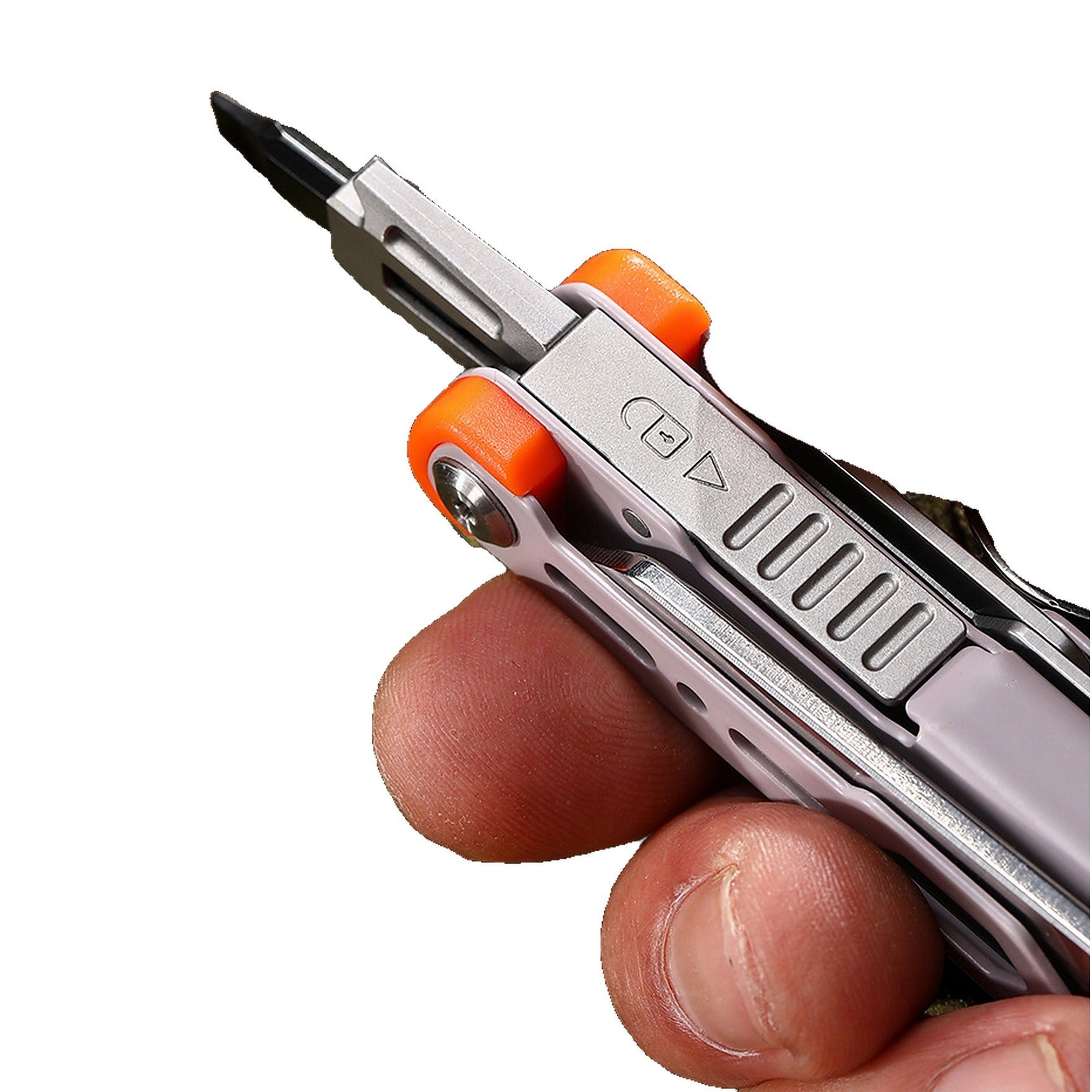 A close-up of a hand holding a compact multi-tool screwdriver with a silver metal body and bright orange pivot accents against a plain white background.